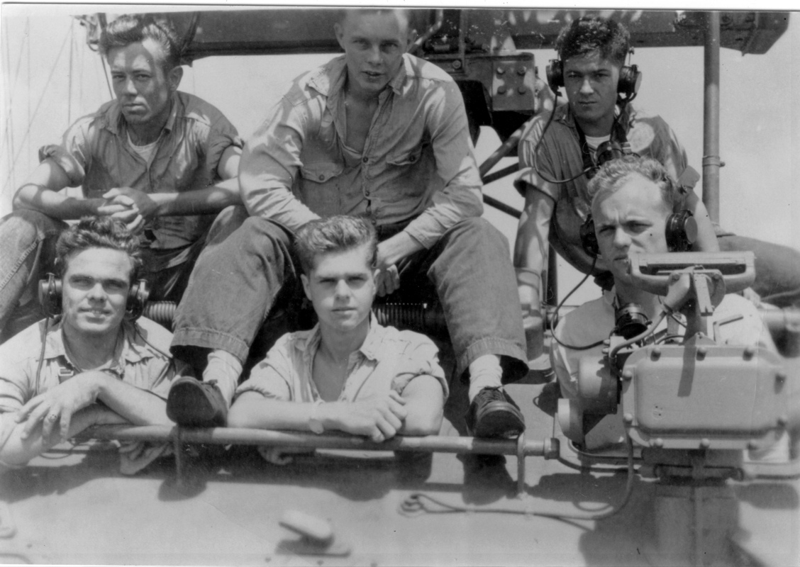 Main Battery Director Crew.<br>BACK ROW (L&rarr;R) [unknown], H. Klonts, J. Reardon.<br>FRONT ROW (L&rarr;R) W. Bates, H. Nickerson, W. ALexander.